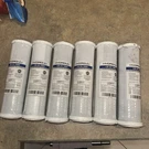 6 New In Plastic But Damaged Hydronix CB-25-1005 Nsf Carbon Block Filters. Fixed Price $50.00.