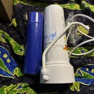 Rain Soft Water Filtration System With Filter And Hose Attachment For Home. Fixed Price $18.00.